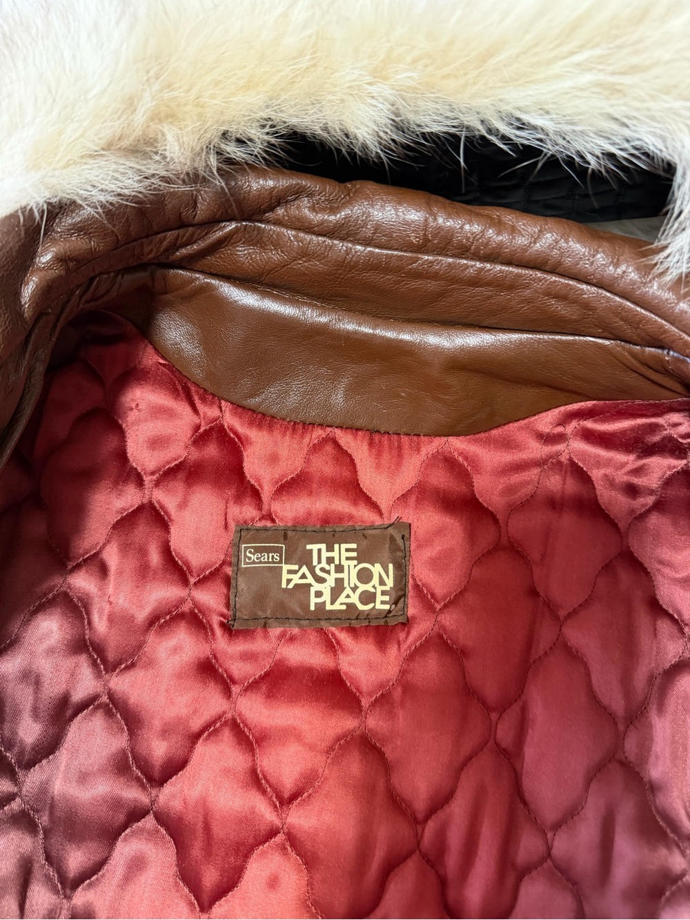 The Fashion Place by Sears Women's Brown Leather Coat with Red Quilted Lining.